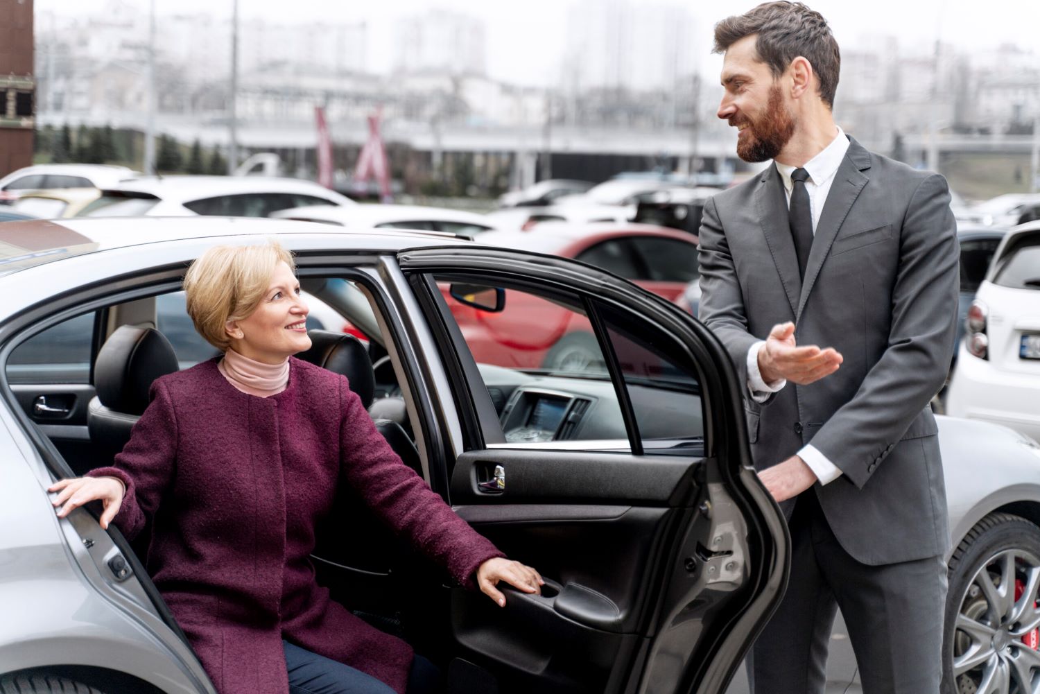 taxi-driver-female-client-interacting-formal-way-scaled
